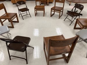 Empty chairs arranged in a circle